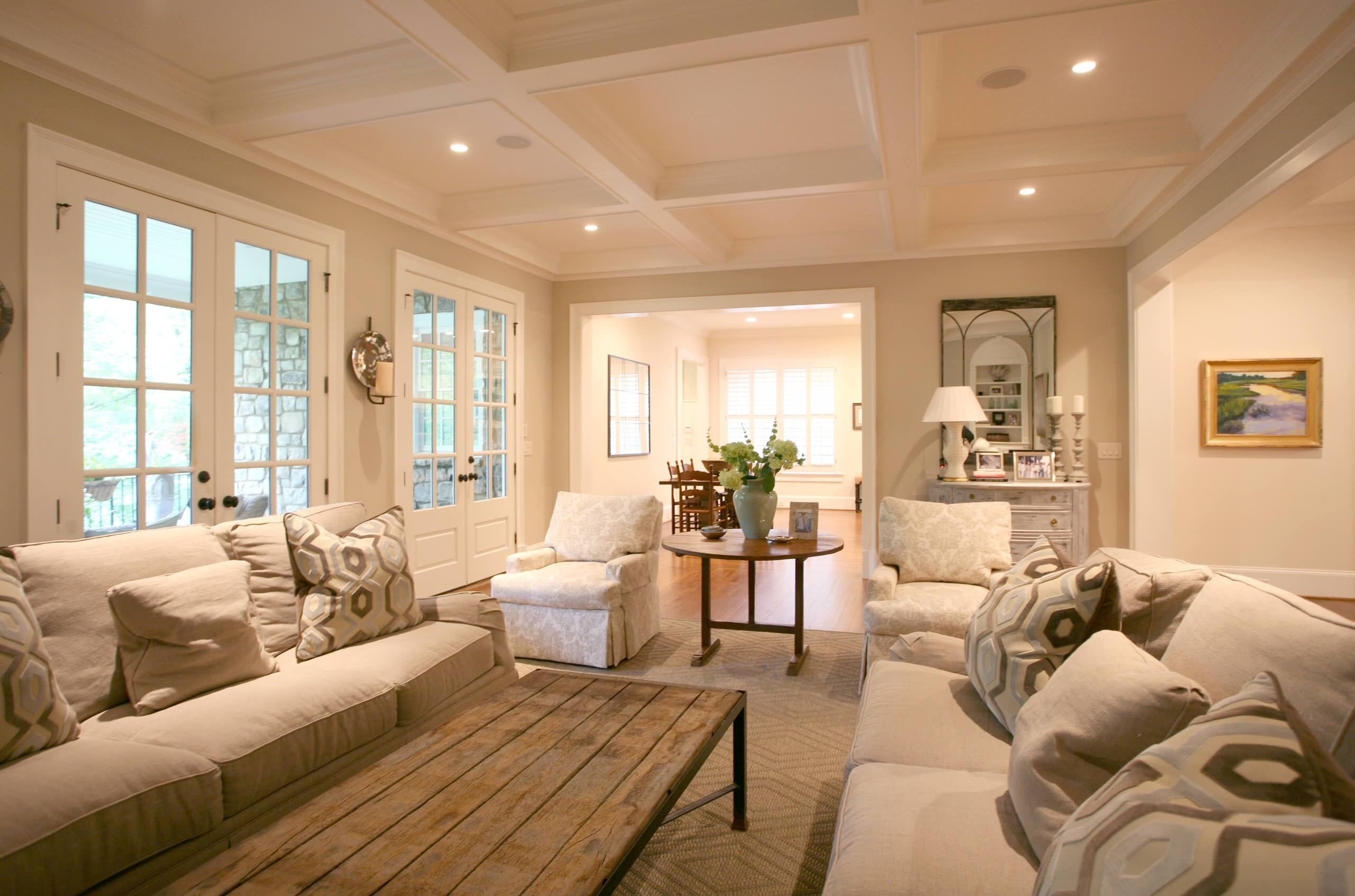 How Do I Decorate a Small Living Room with High Ceilings?
